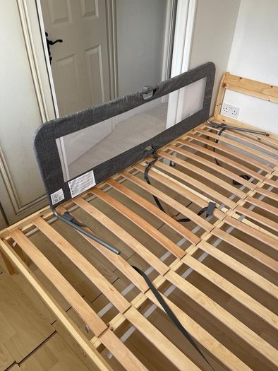 Double standard bed with baby bed barrier