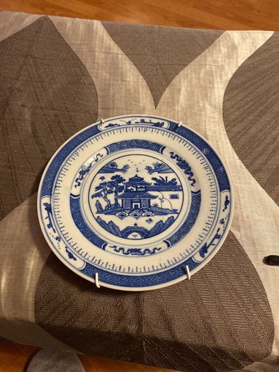 Plate with wall hanger included.