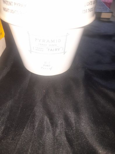 Clarkes Pyramid lamp night light and an Advertisment Box, comprising a white glazed ceramic reservoir marked Prices Patent Candle Company Limited, London