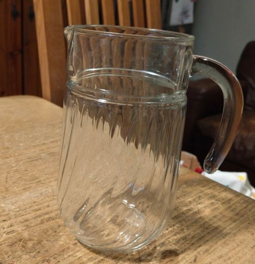 Luminarc glass pitcher with a ribbed design.