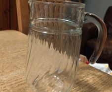 Luminarc glass pitcher with a ribbed design.