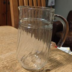 Luminarc glass pitcher with a ribbed design.