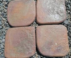 Outdoor exterior paving tiles in rusty red terracotta
