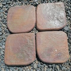 Outdoor exterior paving tiles in rusty red terracotta