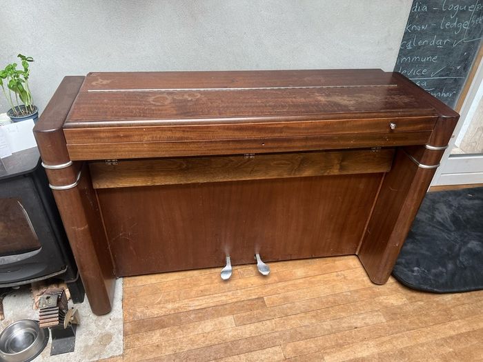 compact art deco piano