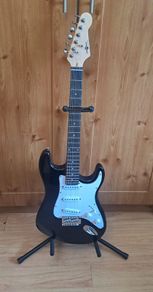 Electric guitar plus case and amp and other pieces