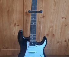 Electric guitar plus case and amp and other pieces