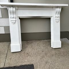 Cast iron mantlepiece and inset.