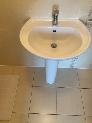 Sink pedestal and tap