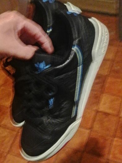 beautiful black leather Adidas runners