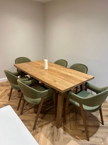 Extendable oak dining table with 6 olive green chairs