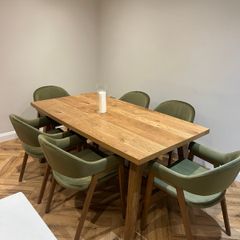 Extendable oak dining table with 6 olive green chairs