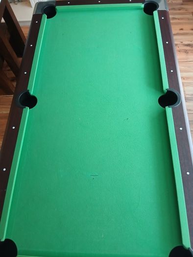 Pool table with cues and balls