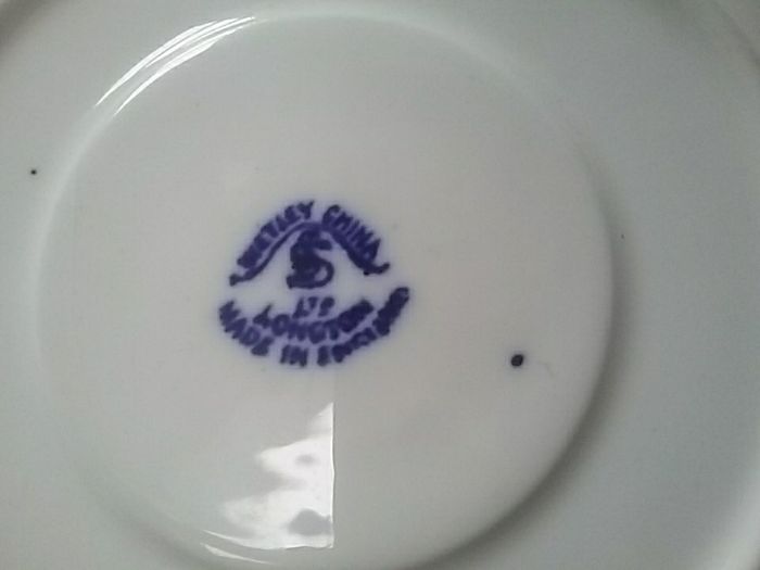 Four Blue Willow Saucers