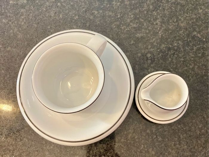 Coffee cup and cream jug