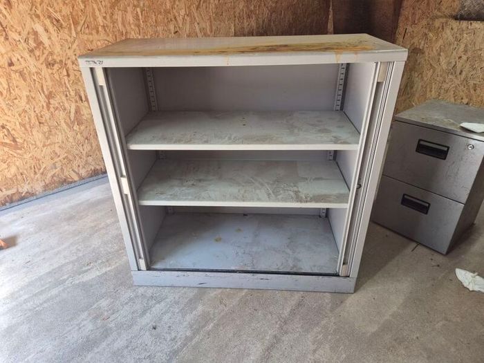 Roll door shelf unit