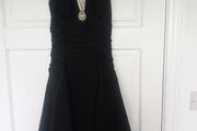 Black halterneck dress with cream trim