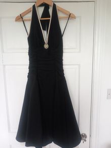 Black halterneck dress with cream trim