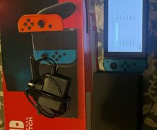 Nintendo switch barely ever used still have box, charger and docking station looking to get rid of