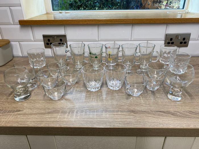 Collection of assorted glass cups and mugs