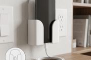 Wall-mounted phone holder