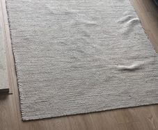 Cream Nordic touch rug with specs of colour from rugs ie 140 by 200cm