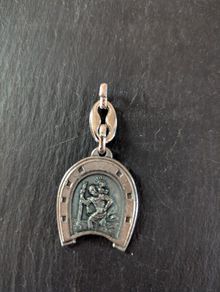 Lucky horseshoe to Saint Christopher medallion