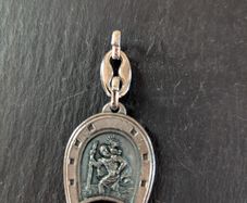 Lucky horseshoe to Saint Christopher medallion