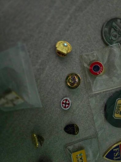 14 pins and 11 key rings from different football associations around the world