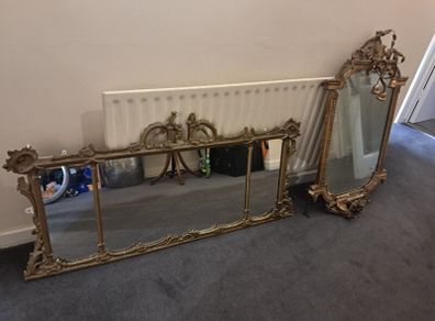 Two distinct antique giltwood mirrors with elaborate French-style ornamentation