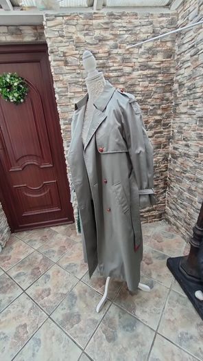 Vintage Nuage ladies trenchcoat Approximately late 90s early 00s Size 10 on label The colour is a pale bluey grey with brown buttons It's got an inner lining that can be removed