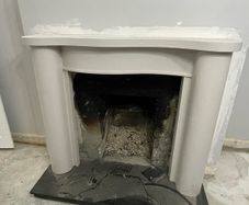 Victorian-style cast iron fireplace insert, surround and hearth