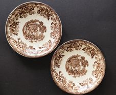 A Pair of Royal Staffordshire Tonquin Brown Transferware Saucers by Clarice Cliff