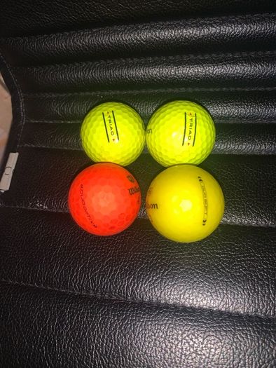 (4) Wilson colored golf balls