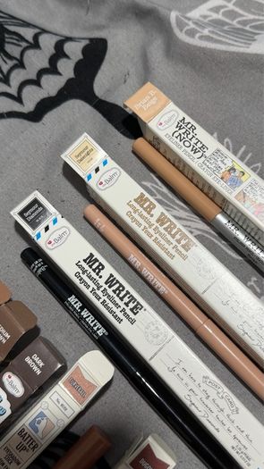The balm tinted brow gel, clear brow gel, white, black eye pencils, liquid eyeliners