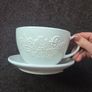 plant pot in the shape of a cup and saucer. Image 2