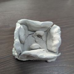 Handmade ornaments of a football stadium.