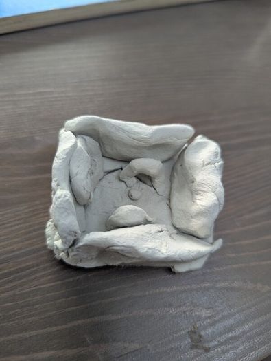Handmade ornaments of a football stadium.