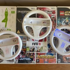 10 Nintendo Wii Games with three game wheels MUST GO ASAP!