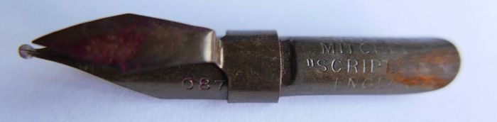 Vintage dip pen with collection of assorted nibs