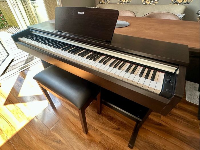 Yamaha Arius YDP-142 Digital Piano with rosewood finish and matching stool