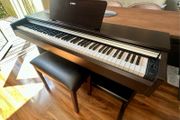 Yamaha Arius YDP-142 Digital Piano with rosewood finish and matching Yamaha stool