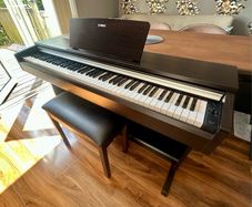 Yamaha Arius YDP-142 Digital Piano with rosewood finish and matching stool