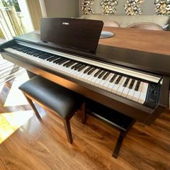 Yamaha Arius YDP-142 Digital Piano with rosewood finish and matching stool