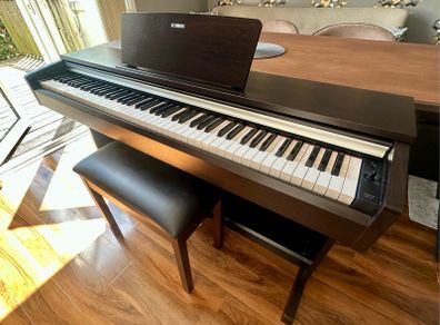 Yamaha Arius YDP-142 Digital Piano with rosewood finish and matching stool