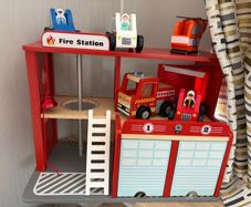 Wooden fire station and emergency vehicles