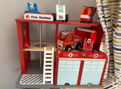Wooden fire station and emergency vehicles