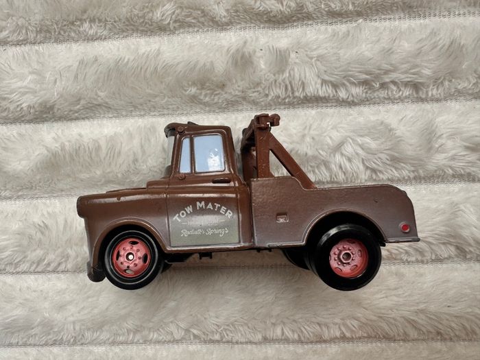 Disney Pixar Cars Radiator Springs Tow Mater Truck Diecast Metal Vehicle approx. 9.5 cm. length one of the back wheels is not working usad Please see photos