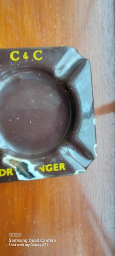 C & C Dry Ginger "ale" enamel metal ashtray ,dark brown,  very old vintage advertising ashtray, hard to come by ,collectors item,used condition  see pictures
