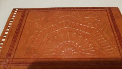 handcrafted made soft leather wallet,with designs ,, thank you,,was used,some wear and tear,,take as is ..